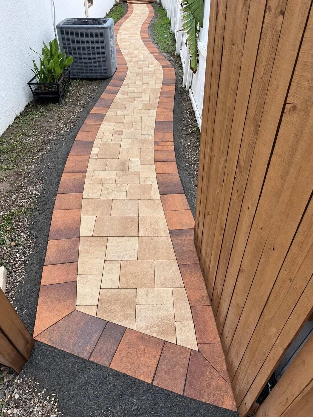 Curved paver walkway by Cavisa Solutions