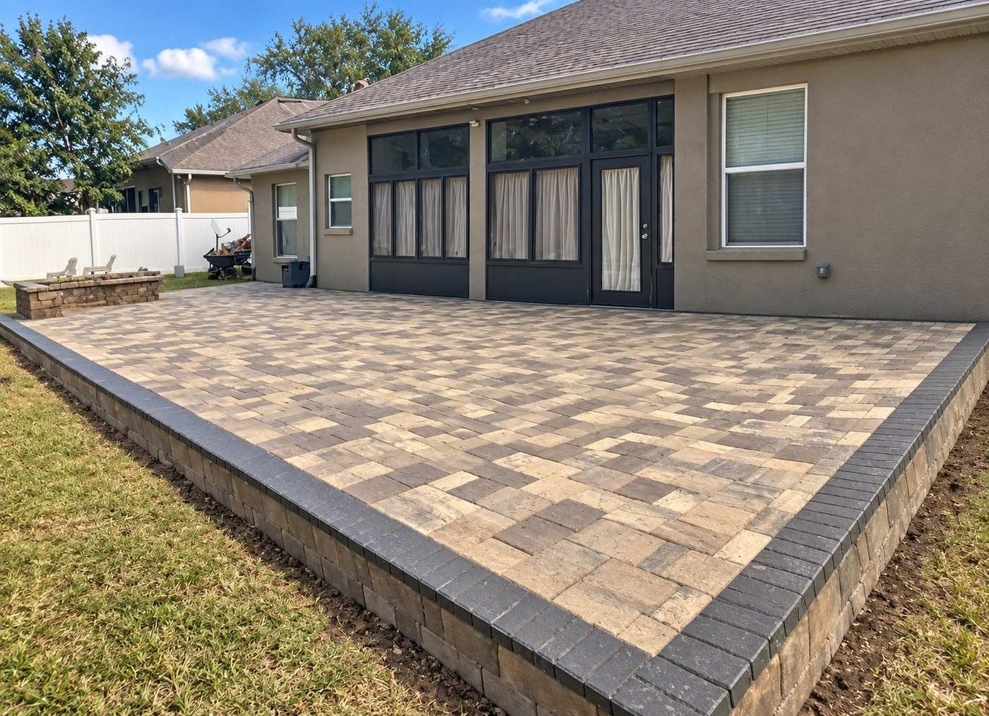 Paver patio with fire pit by Cavisa Solutions